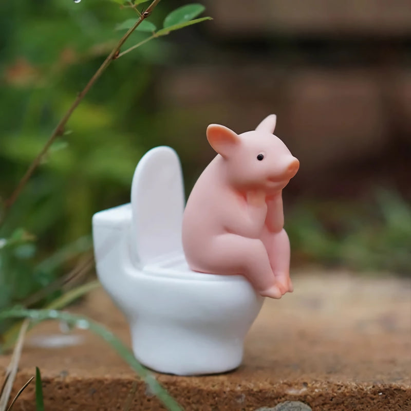 cartoon pig sitting on toilet desktop ornament - MRSLM
