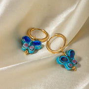 Blue flower butterfly stud earrings, view 3 - MRSLM