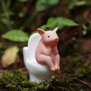 cartoon pig sitting on toilet desktop ornament, view 3 - MRSLM