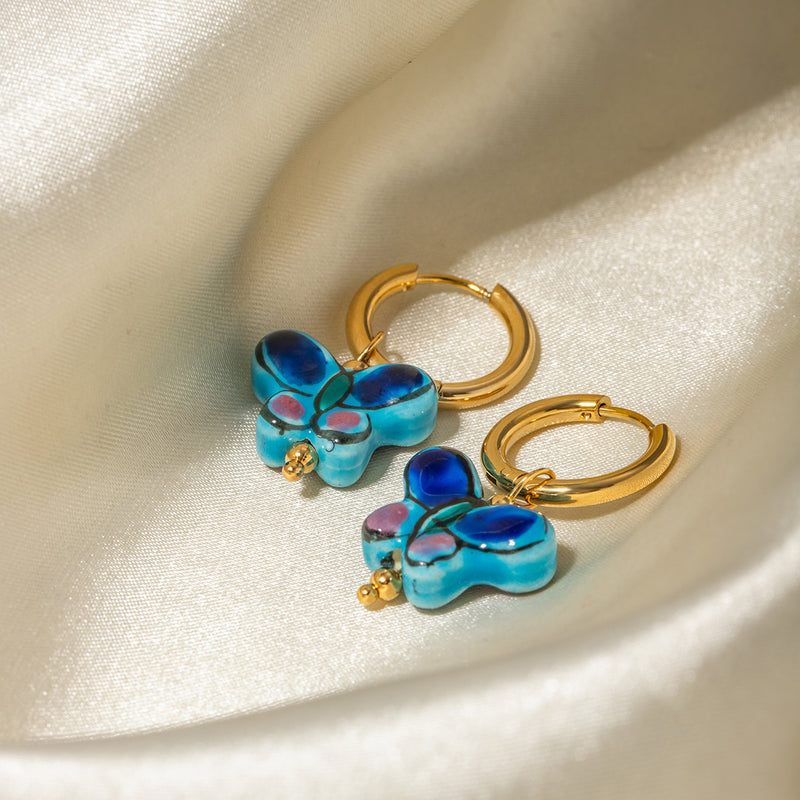 Blue flower butterfly stud earrings, view 4 - MRSLM