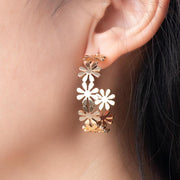 golden C-shaped flower drop earrings - MRSLM