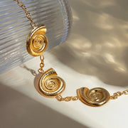gold plated geometric spiral pendant necklace, view 6 - MRSLM