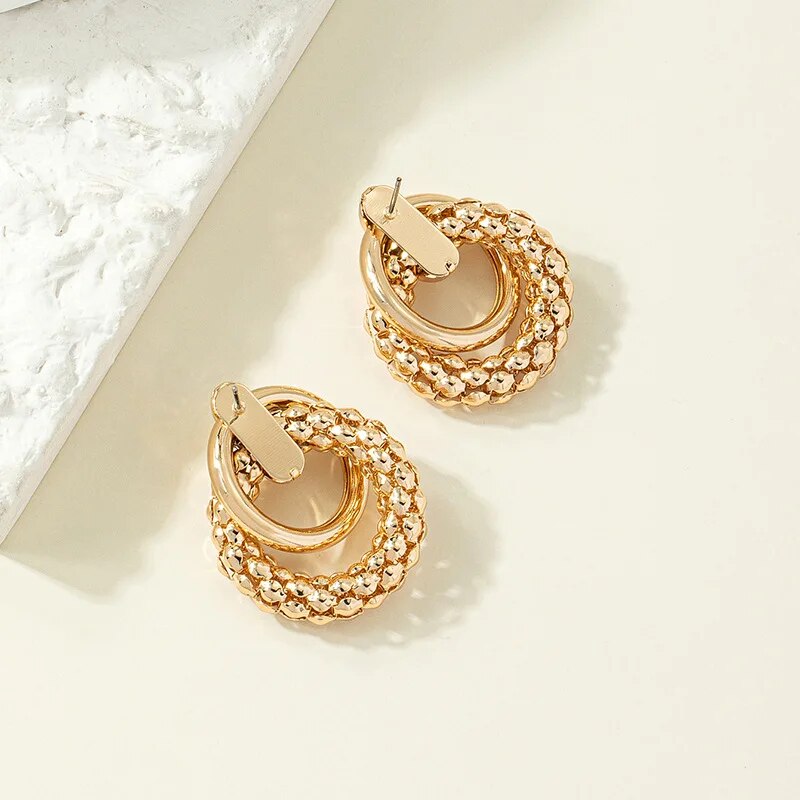 gold metal twist dangle earrings, view 5 - MRSLM