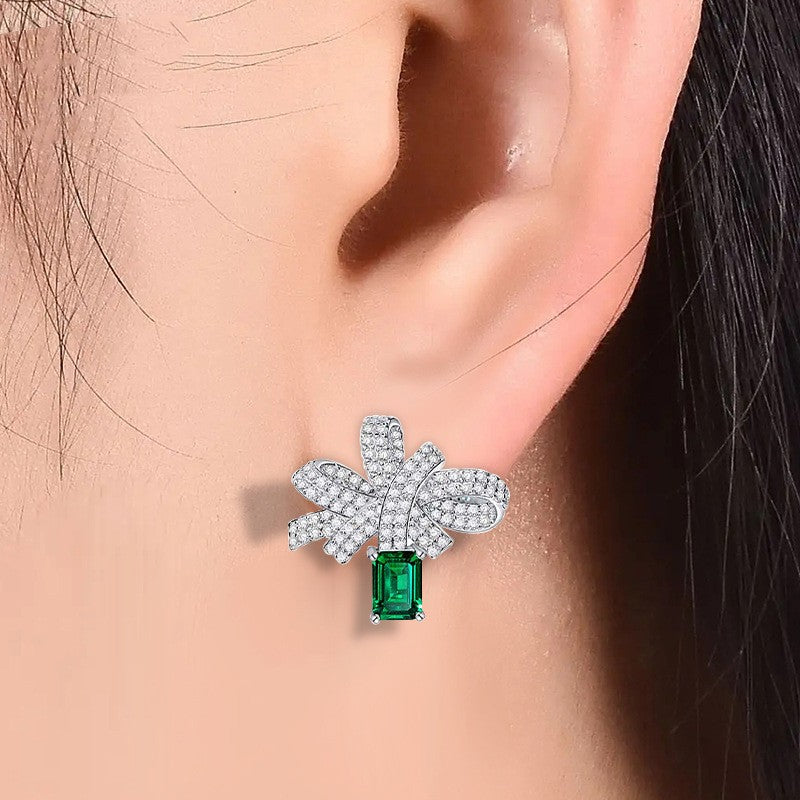 silver bow earrings with simulated emerald - MRSLM