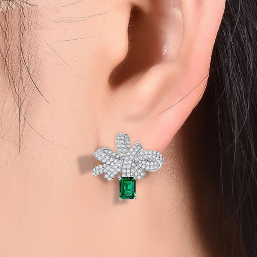 silver bow earrings with simulated emerald - MRSLM