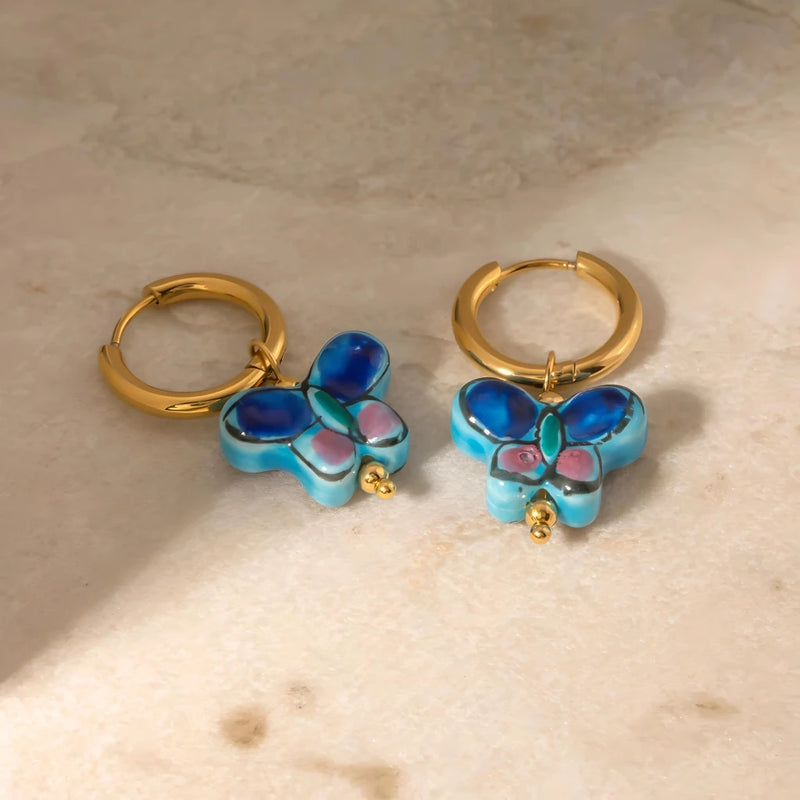 Blue flower butterfly stud earrings, view 5 - MRSLM