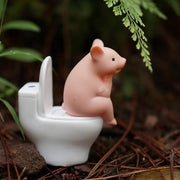 cartoon pig sitting on toilet desktop ornament, view 4 - MRSLM