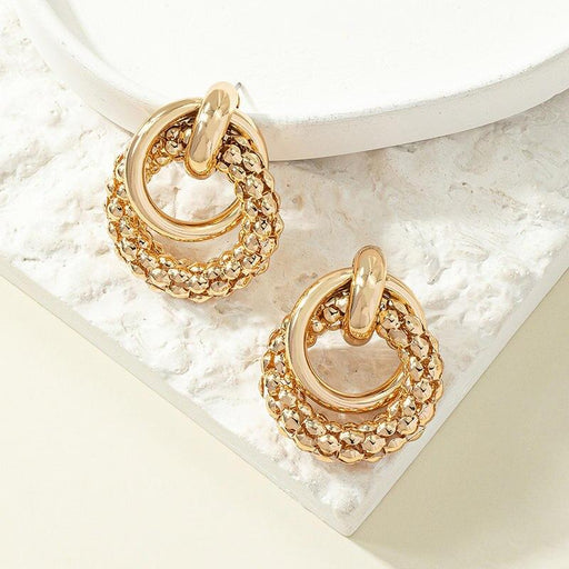 gold metal twist dangle earrings - MRSLM