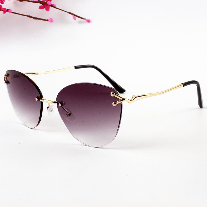 Classic Ocean Film Cat Eye Frameless Cut Edge Sunglasses Fashion Street Shooting Concave Shape Ladies Sunglasses
