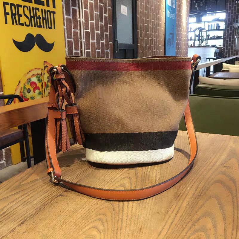 striped canvas bucket bag with tassel, view 5 - MRSLM